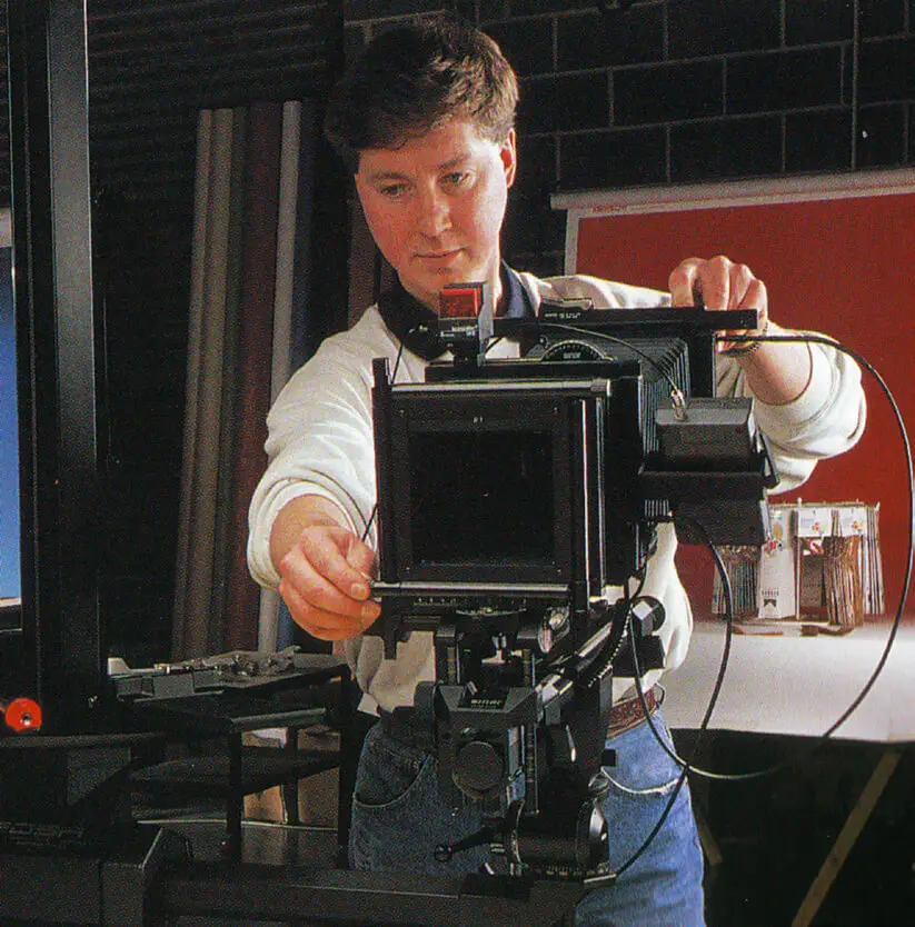 Old photo of a man using an old camera