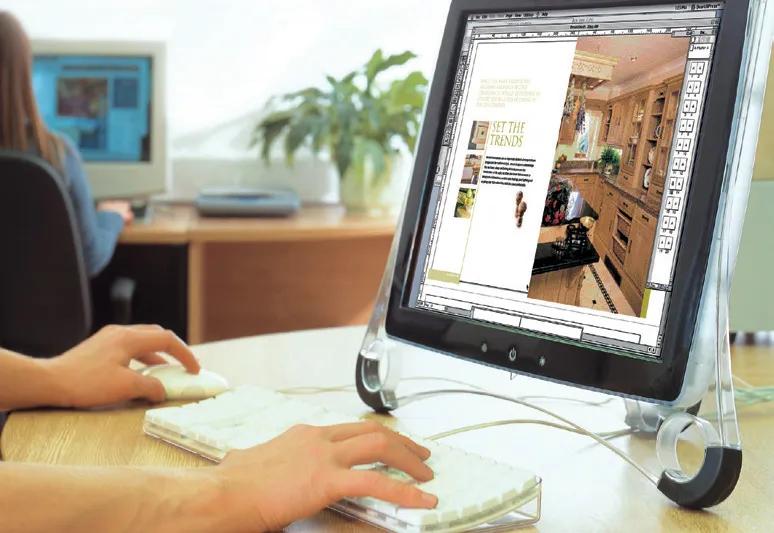 Someone designing a catalogue on a computer